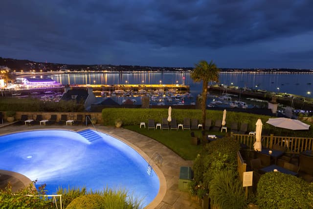 Pool & sea view at night